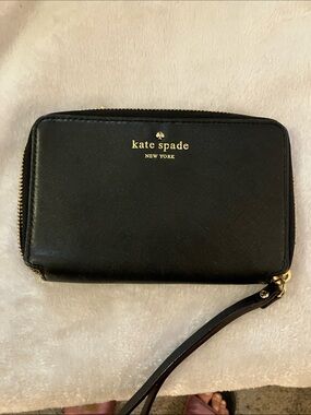 kate spade black leather wristlet with gold logo